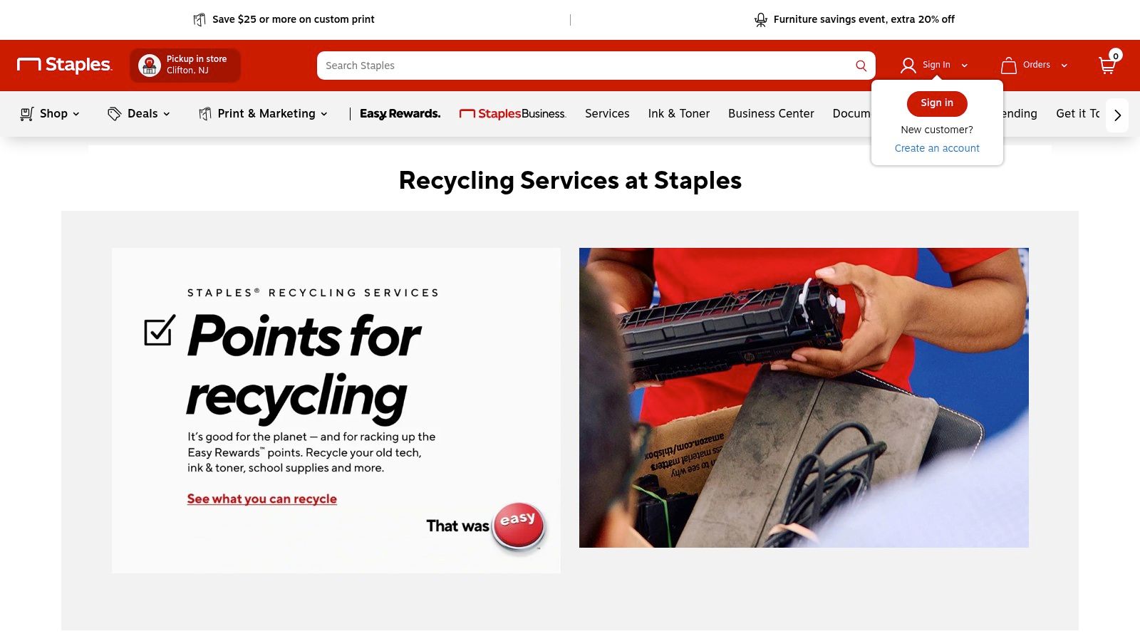 A sign at Staples showing ink and toner cartridge recycling rewards program.